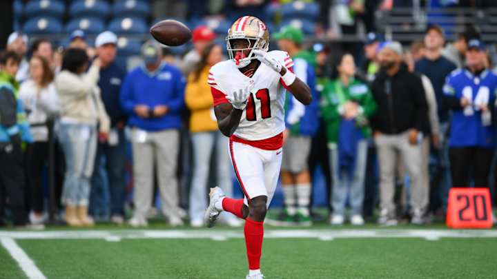 Oct 10, 2024; Seattle, Washington, USA; San Francisco 49ers wide receiver Brandon Aiyuk (11) catches the ball during warmups before the game against the Seattle Seahawks at Lumen Field. Mandatory Credit: Steven Bisig-Imagn Images