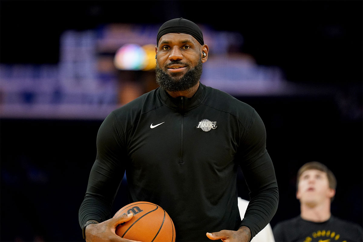 Los Angeles Lakers forward LeBron James (23) holds onto the ball before the start of the game against the Golden State Warriors at the Chase Center.