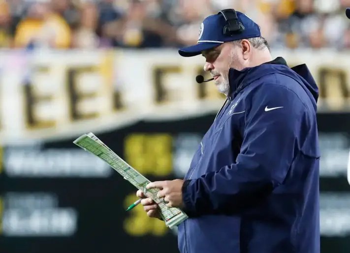 Oct 6, 2024; Pittsburgh, Pennsylvania, USA; Dallas Cowboys head coach Mike McCarthy looks at his play chart against the Pittsburgh Steelers during the second quarter at Acrisure Stadium. Mandatory Credit: Charles LeClaire-Imagn Images